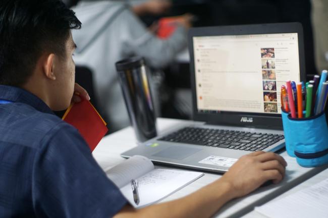 Graduate Student using a laptop computer