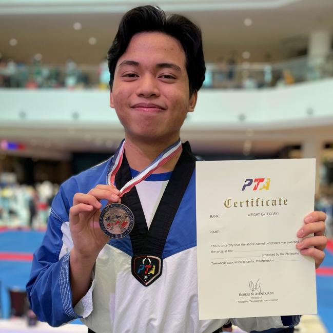 Alonzo Pasion with his medal from the CJ competition 
