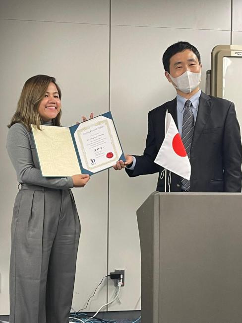 Ms Alcaparas receiving her certificate of completion