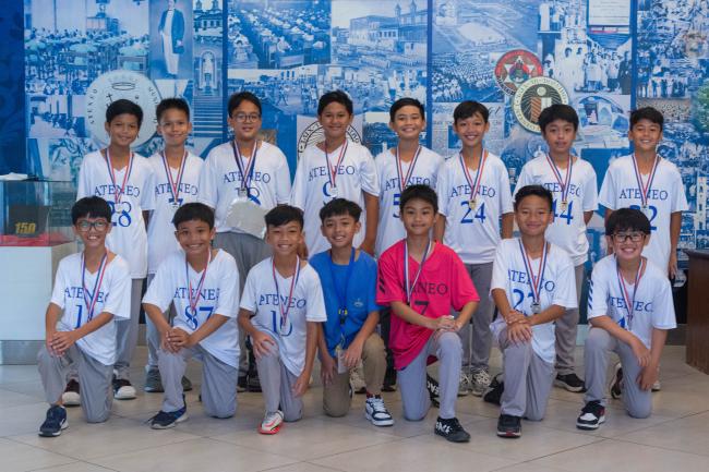 Left to right kneeling: Mateo Villanueva, Harvey Garcia, Kyle Molina, Ted Ureta, Ghazi Dy, Sylar Alcantara, Mateo Diaz; Left to right standing: Reign Cruz, Jesus Goduco, Rafael Lauzon, Bosco Virrey, Javie Bautista, Anton Flameño, Joaquin Kison, Sancho Bautista.