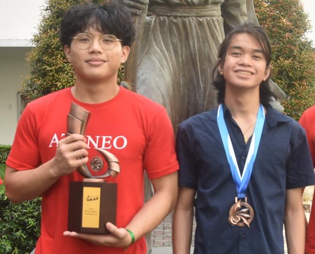 Aldwyn Thor and Malaya Mamaril with the UAAP Season 85 boys’ judo trophy  