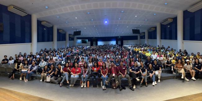 An auditorium filled with rows of seated Pathways students, parents, and staff.