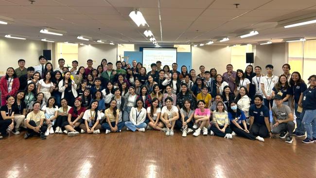 At least 100 Pathways participants, volunteers, and staff join for a group photo