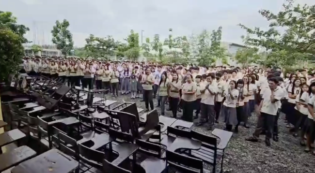Students and teachers of Tagumpay Nagaño High School expressing their gratitude to AJHS for the donated chairs