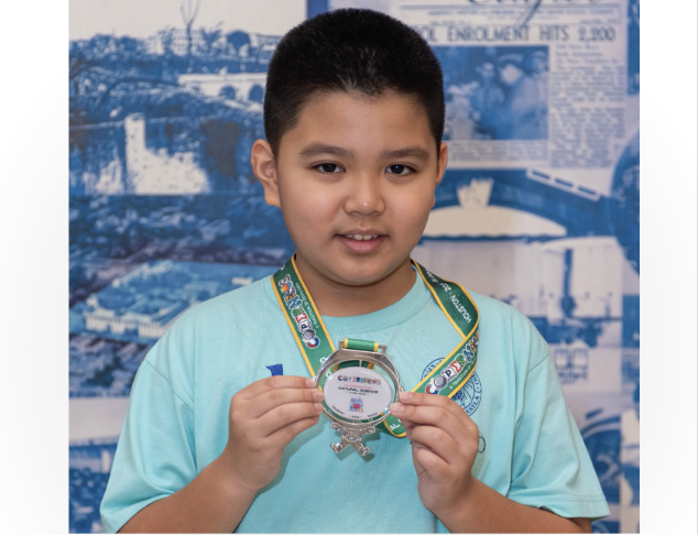 Mika Bagain with his silver medal for the Copernicus Olympiad (Natural Science) 2024 Global Round