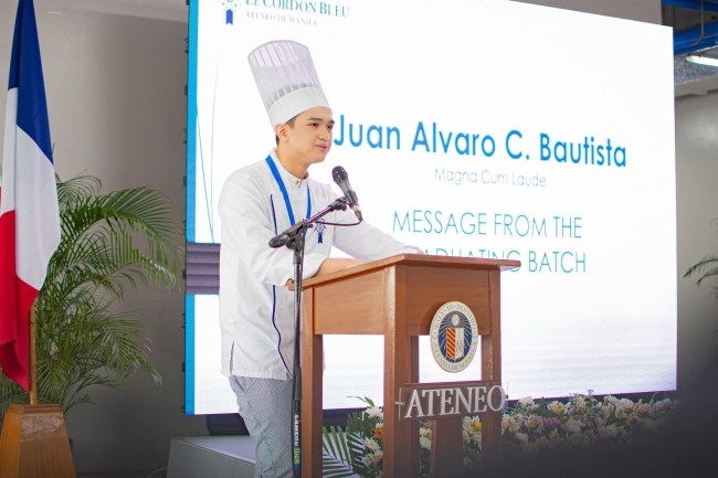Juan Alvaro C Bautista delivering his message from the graduating batch