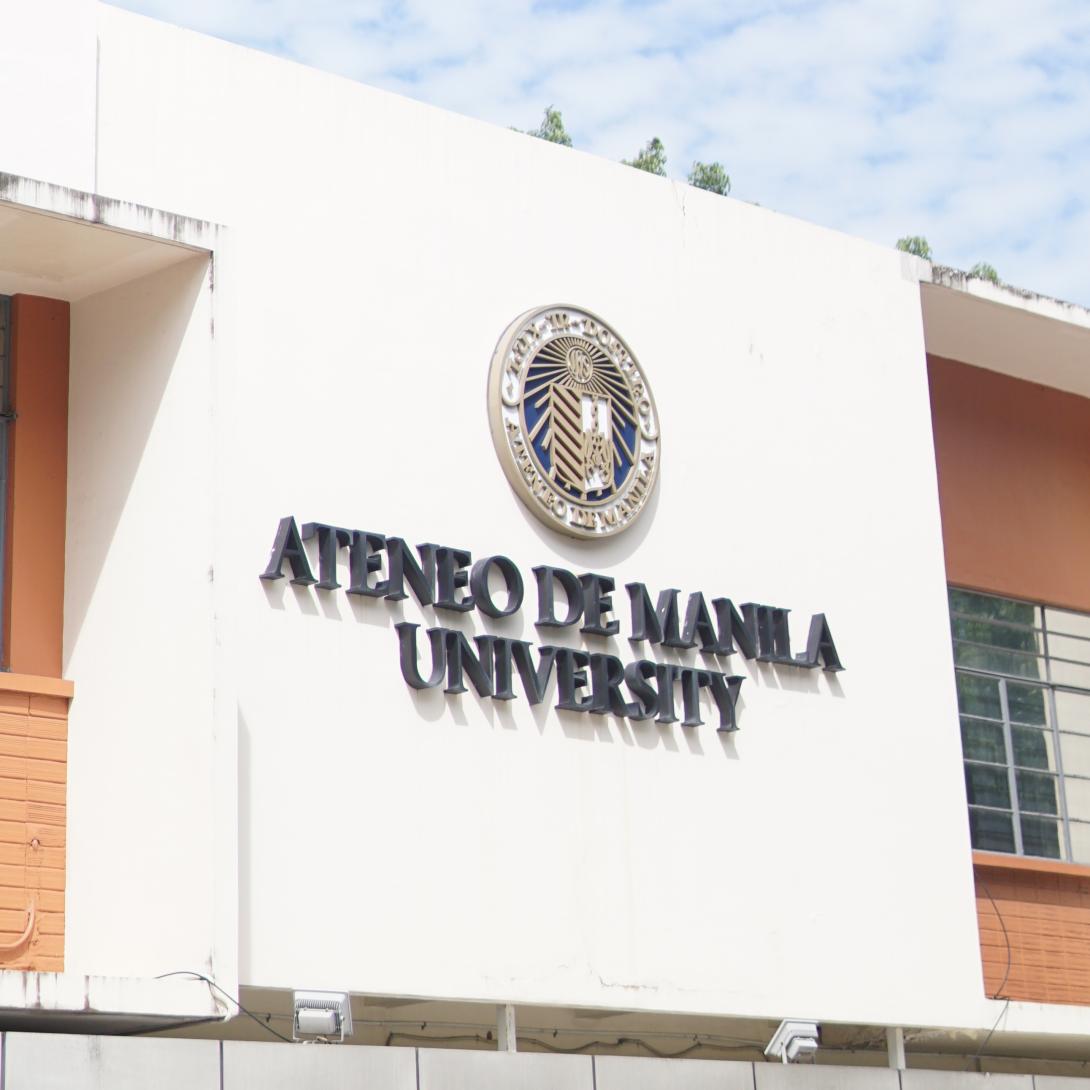 Close up of University seal and logo at Xavier Hall