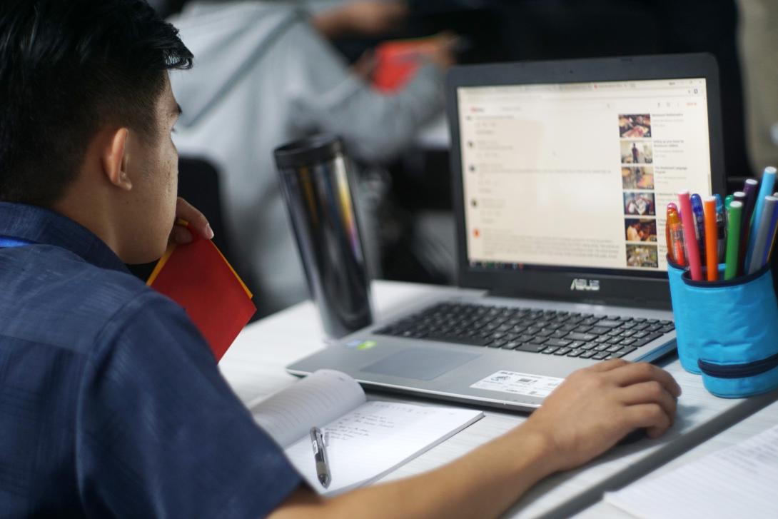 Graduate Student using a laptop computer